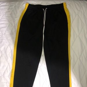 Black Pants With Yellow Stripes